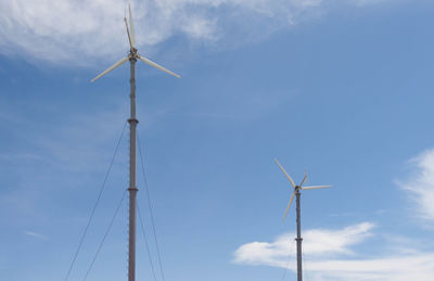 Low angle view of wind turbine against sky