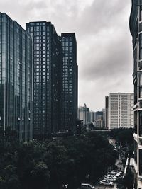 Modern buildings in city against sky
