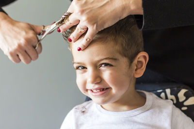 Portrait of boy having haircut