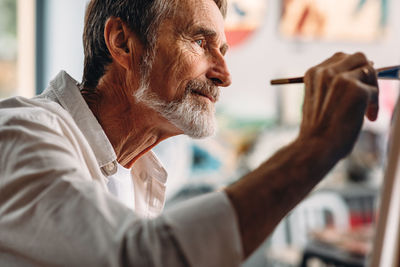 Portrait of man holding camera