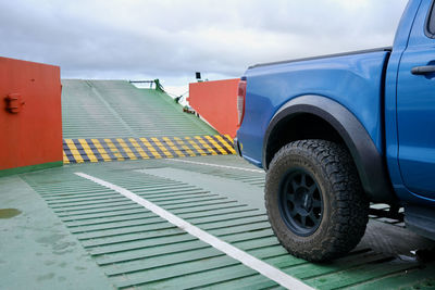 Low angle view of car on road against sky