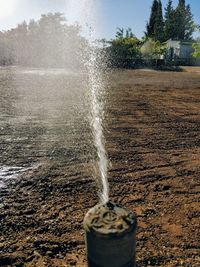 Close-up of water splashing against sky