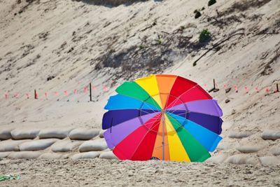 Multi colored umbrella on beach