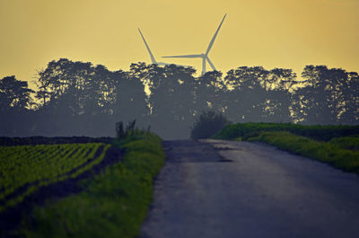Country road against wind turbines