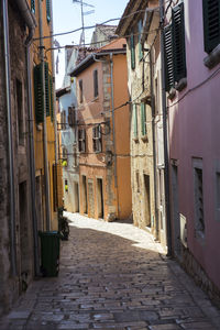 Narrow alley amidst buildings in town