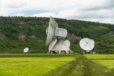 Built structure on field against sky