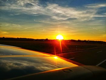 Scenic view of sunset seen through airplane window