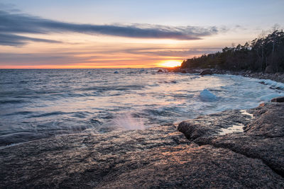 Scenic view of sea against sky during sunset