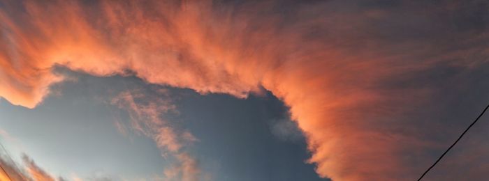 Low angle view of dramatic sky during sunset