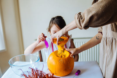 Portrait of smiling young woman holding pumpkin