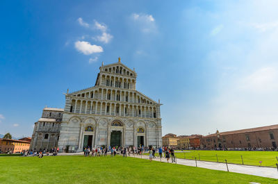 Group of people in front of historical building