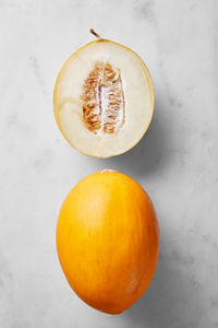 High angle view of honeydew melons over white background