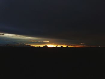 Silhouette landscape against sky during sunset