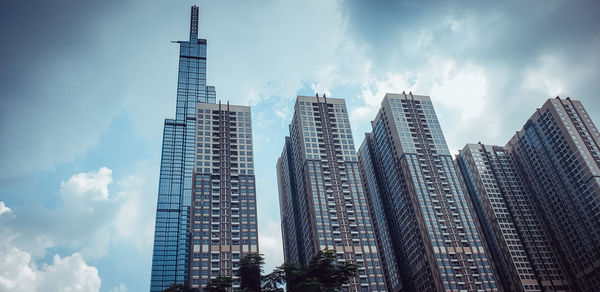 Low angle view of modern buildings against sky