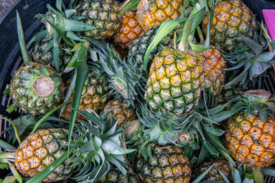 High angle view of fruits at market pine pple