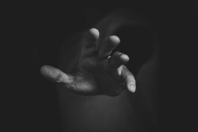 Close-up of a human hand against blurred background