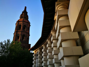 Low angle view of clock tower against sky