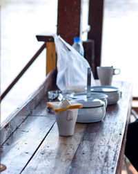 Close-up of coffee cup and bread on table