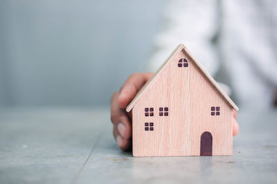 Close-up of toy on table against house in building