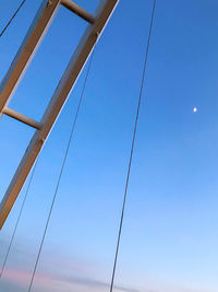 Low angle view of bridge against clear blue sky