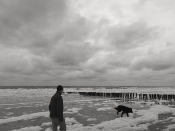 Scenic view of sea against cloudy sky