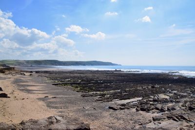 Scenic view of beach against sky