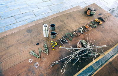 High angle view of plants with container on table