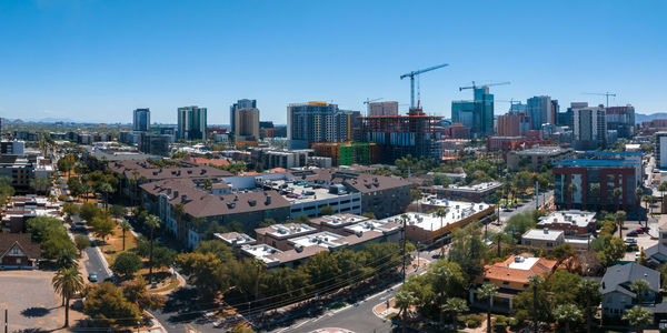 Cityscape against clear blue sky