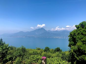 Scenic view of mountains against blue sky