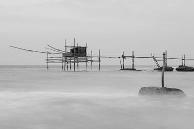 Lifeguard hut on sea against clear sky