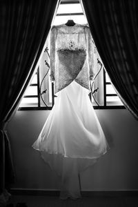 Close-up of clothes hanging on floor