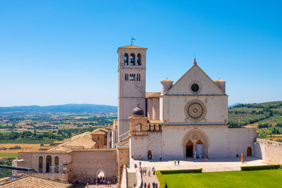 The wonderful basilica of st. francis in assisi, italy, during a summer sunny day.