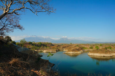 Scenic view of lake against blue sky