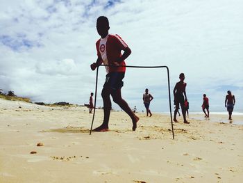 Woman playing on beach
