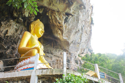 Low angle view of buddha statue