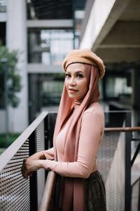 Portrait of young woman sitting on seat