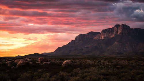 View of mountain range against sunset sky