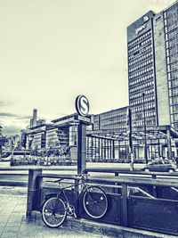 Bicycles on road against buildings in city