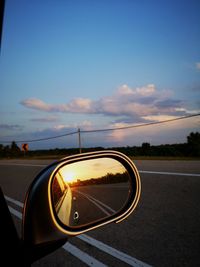 Reflection of road in side-view mirror