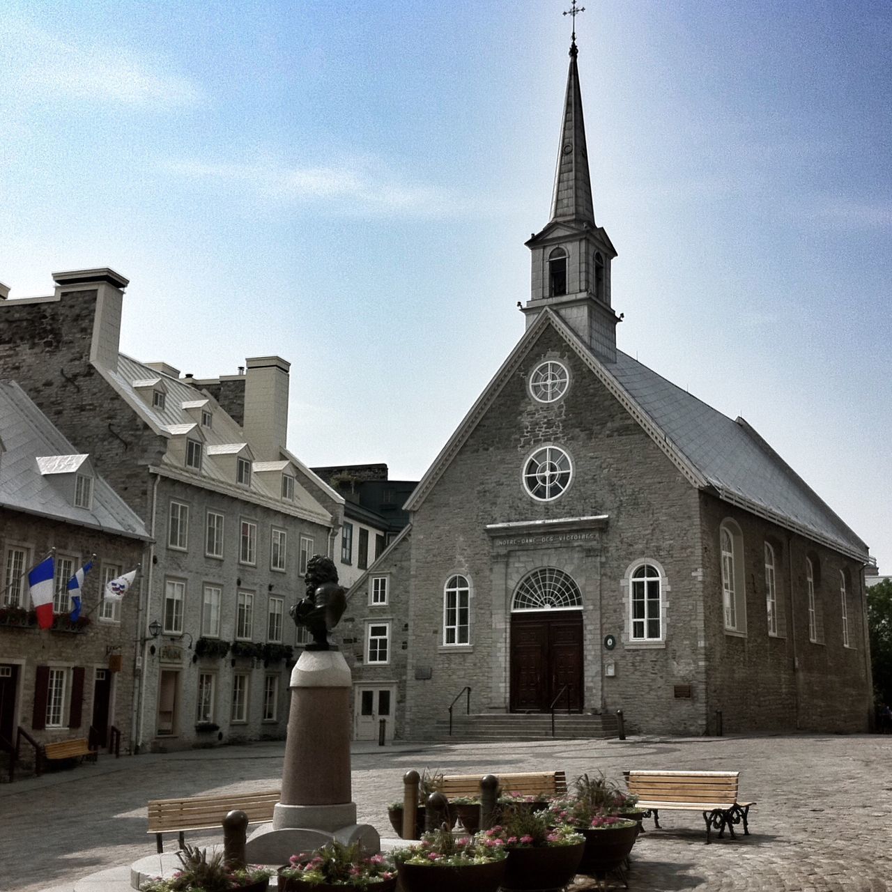 building exterior, religion, church, architecture, place of worship, spirituality, built structure, cross, cathedral, sky, low angle view, dome, steeple, facade, sunlight, day, tower, outdoors