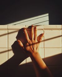Close-up of hand on cutting board