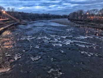 Frozen landscape against sky