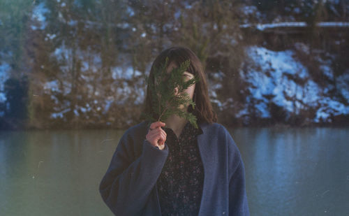 Woman holding leaf