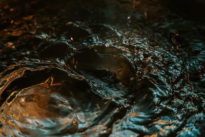 Full frame shot of water flowing on rock