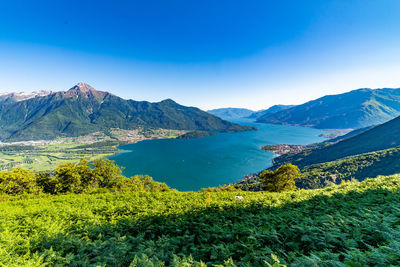 Panorama on lake como, with villages of gera lario, domaso, and the mountains that overlook them.