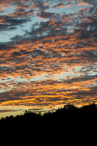 Scenic view of dramatic sky during sunset