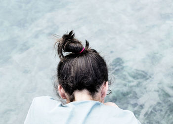 Rear view of woman with umbrella