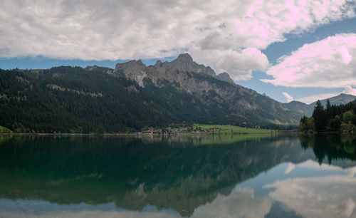 Scenic view of lake and mountains against sky