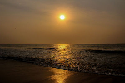 Scenic view of sea against sky at sunset