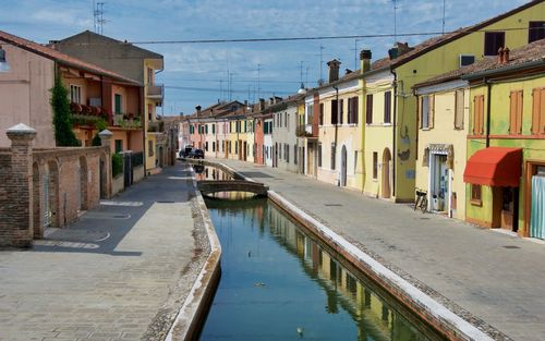 Canal amidst buildings in town